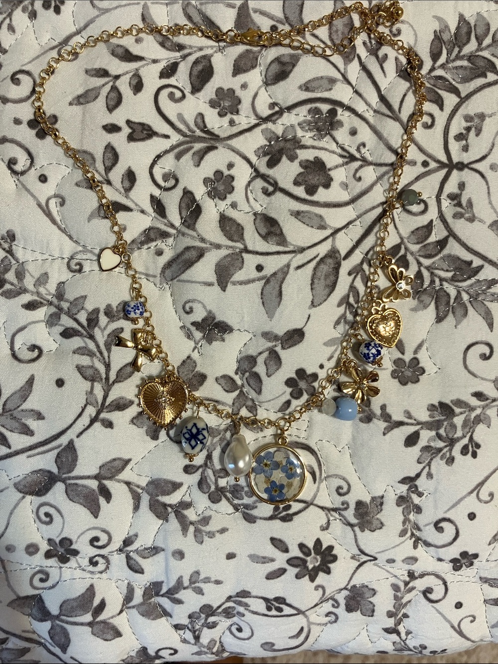 Francescas Gold Charm Necklace with Blue Porcelain Accents